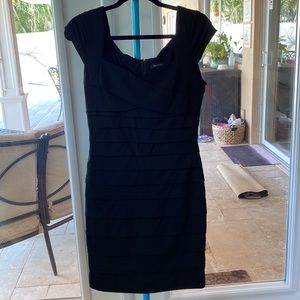 WHBM black stretchy crisscross dress with cap sleeves. Size 10. Lined